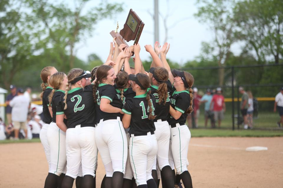 Yorktown softball celebrates after beating Bellmont 5-2 in their regional championship game at Yorktown Sports Park on Tuesday, May 31, 2022.