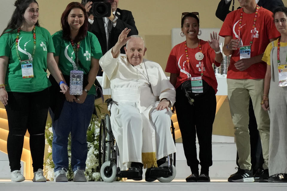 Pope Francis waves as he arrives for the 37th World Youth Day flock to the Parque Tejo in Lisbon, Saturday, Aug. 5, 2023. On Sunday morning, the last day of his five-day trip to Portugal, Francis is to preside over a final, outdoor Mass on World Youth Day – when temperatures in Lisbon are expected to top 40 degrees C (104F) – before returning to the Vatican. (AP Photo/Armando Franca)