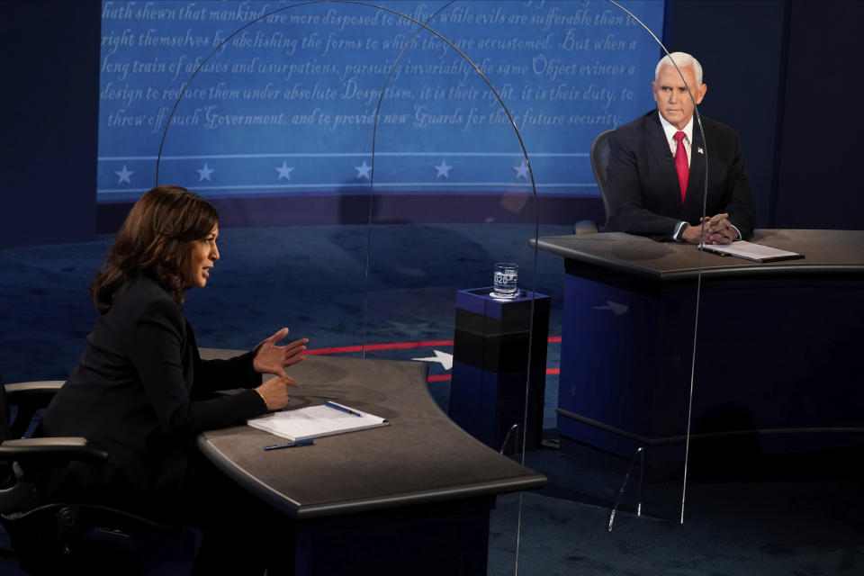 Vice President Mike Pence looks at Democratic vice presidential candidate Sen. Kamala Harris, D-Calif., as she answers a question during the vice presidential debate Wednesday, Oct. 7, 2020, at Kingsbury Hall on the campus of the University of Utah in Salt Lake City. (AP Photo/Morry Gash, Pool)