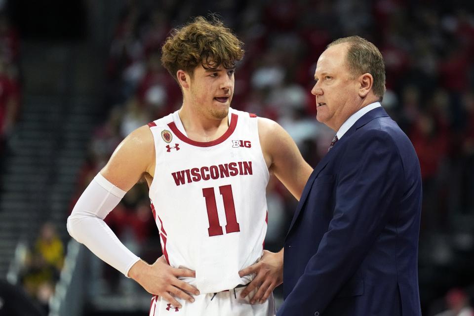 Nov 15, 2022; Madison, Wisconsin, USA; Wisconsin Badgers guard Max Klesmit (11) talks with Wisconsin Badgers head coach Greg Gard during the first half against the Green Bay Phoenix at the Kohl Center. Mandatory Credit: Kayla Wolf-USA TODAY Sports