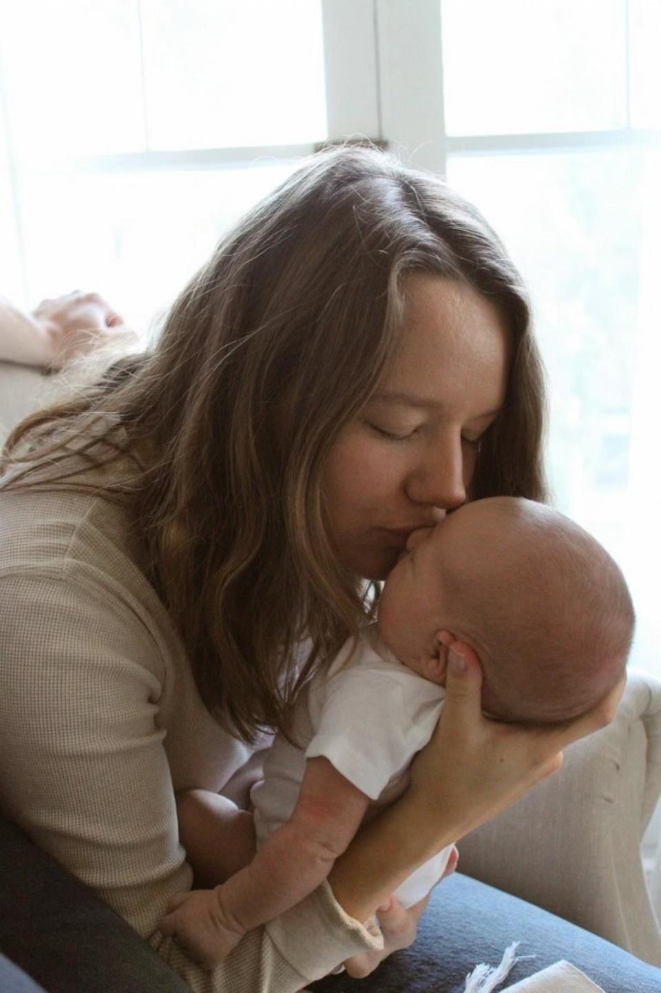 PHOTO: Sydney Melton gives her baby girl a kiss on her forehead. (Courtesy of Trevor and Sydney Melton)