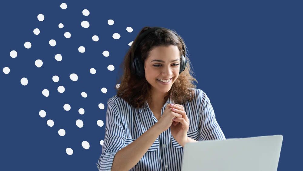 woman sitting at a laptop.