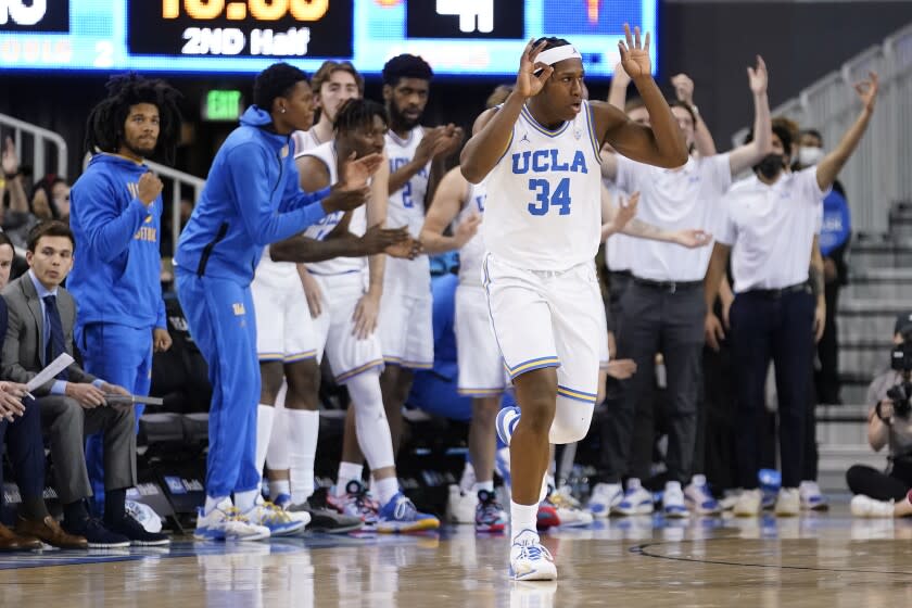 UCLA guard David Singleton (34) reacts after making a 3-point basket during the second half.