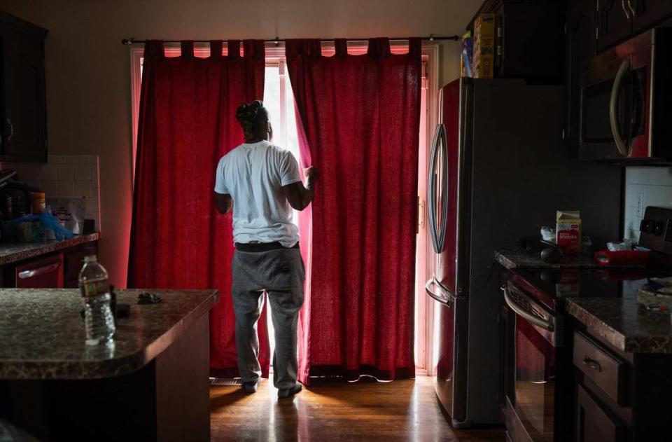 John Roddy says he is sometimes triggered to check outside when he hears a car driving down his street. Zachary Linhares/The Kansas City Star