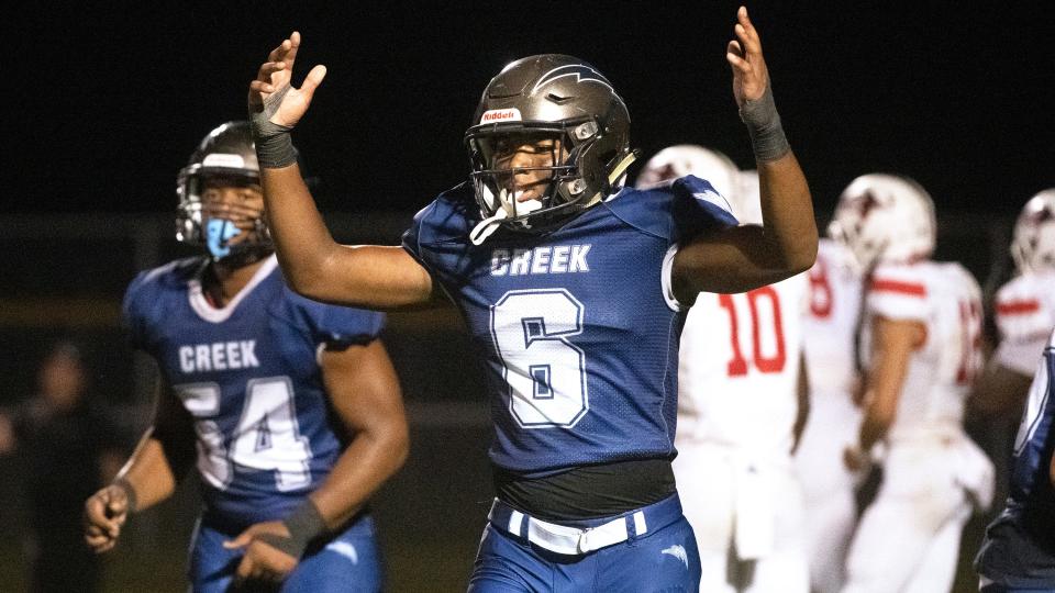 Timber Creek's Brahim Wynn, center, celebrates during the football game between Timber Creek and Rancocas Valley played at Timber Creek Regional High School in Sicklerville on Friday, September 16, 2022.  Timber Creek defeated Rancocas Valley, 28-15.  