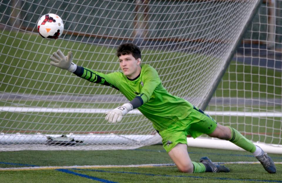 Lincoln Lions goalie Oskar Caldarone dives but misses the stop for the only score against the Lions in their 4-1 win over the Thunderbolts.  [The Providence Journal / Kris Craig]