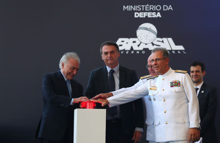 Brazil's President Michel Temer, President-elect Jair Bolsonaro, Brazilian Navy admiral Eduardo Bacellar Leal Ferreira and Bento Costa Lima Leite de Albuquerque Junior, General Director of Nuclear and Technological Development of the Navy, participate in the inauguration ceremony of the submarine "Riachuelo", built by the submarine development program (PROSUB), in Itaguai, Brazil December 14, 2018. REUTERS/Pilar Olivares