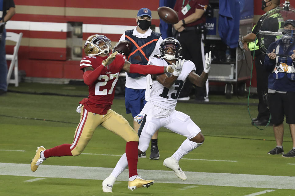 Travis Fulgham catches a touchdown pass in front of Dontae Johnson.