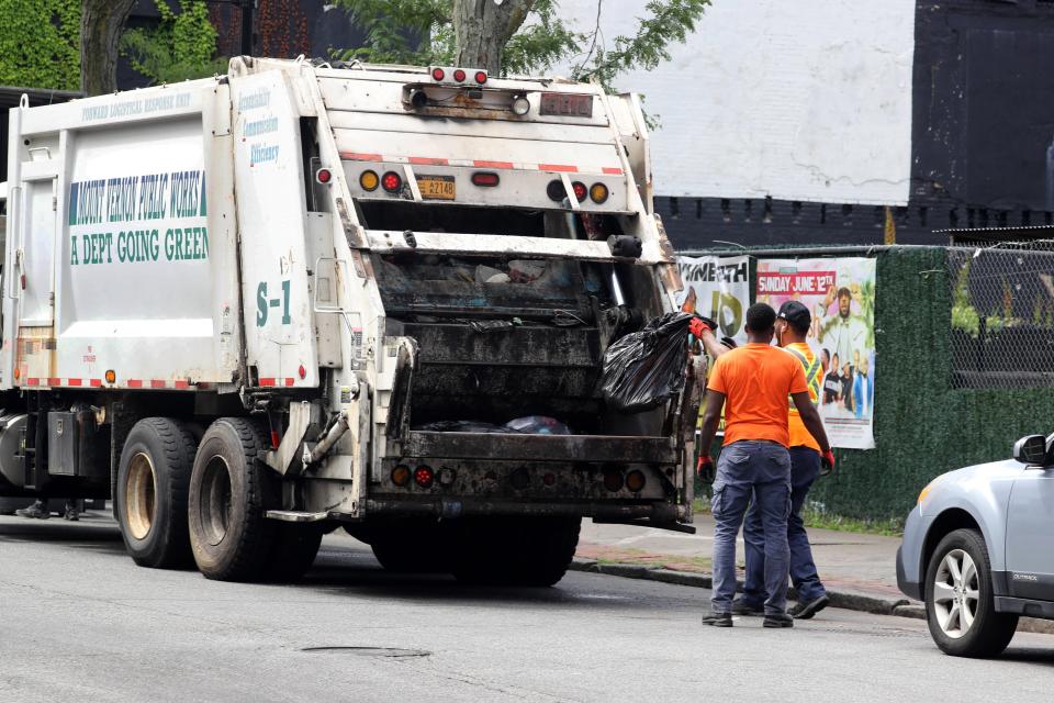 A Mount Vernon sanitation crew collects garbage June 14, 2022. Some municipal workers throughout the region will receive hazard pay bonuses for working through the first year of COVID, with payments as high as $3,000 for first responders and essential workers in New Rochelle, and up to $5,000 for most city of Mount Vernon employees.