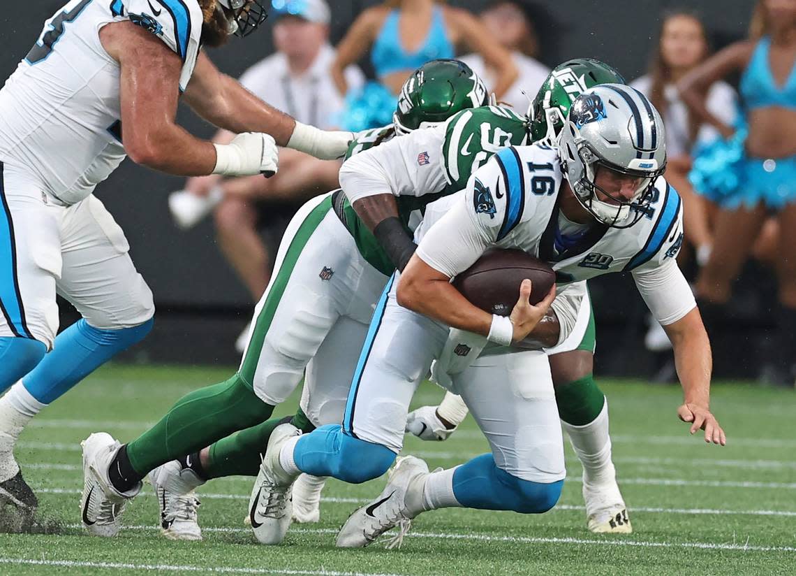 Carolina Panthers quarterback Jack Plummer is sacked by the New York Jets Will McDonald IV during second quarter action at Bank of America Stadium in Charlotte, NC on Saturday, August 17, 2024.