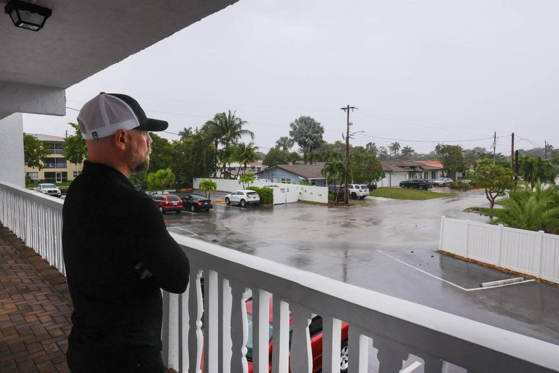 Jason Fogelman, 45, looks at the homes at Coral Ridge Isles from outside his Casa Del Sol apartment in Fort Lauderdale, Florida, Friday, March 22, 2024.