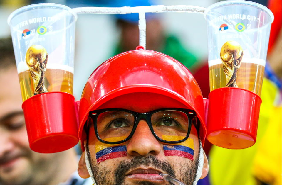 <p>A supporter of Team Colombia drinking beer ahead of the 2018 FIFA World Cup Round of 16 match between Colombia and England at Spartak Stadium. Mikhail Tereshchenko/TASS (Photo by Mikhail Tereshchenko\TASS via Getty Images) </p>