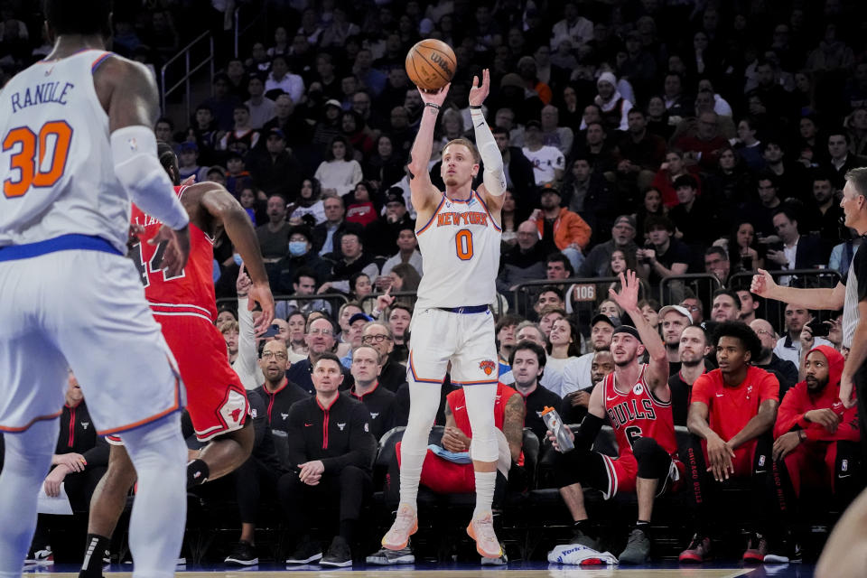 New York Knicks guard Donte DiVincenzo (0) shoots the ball during the first half of an NBA basketball game against the Chicago Bulls in New York, Wednesday, Jan. 3, 2024. (AP Photo/Peter K. Afriyie)
