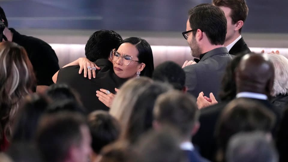 Ali Wong embraces "Beef" co-star Steven Yeun after he wins the award for outstanding lead actor in a limited or anthology series or movie at Monday's Emmy Awards. Wong also won for her performance in the series. - Chris Pizzello/Invision/AP