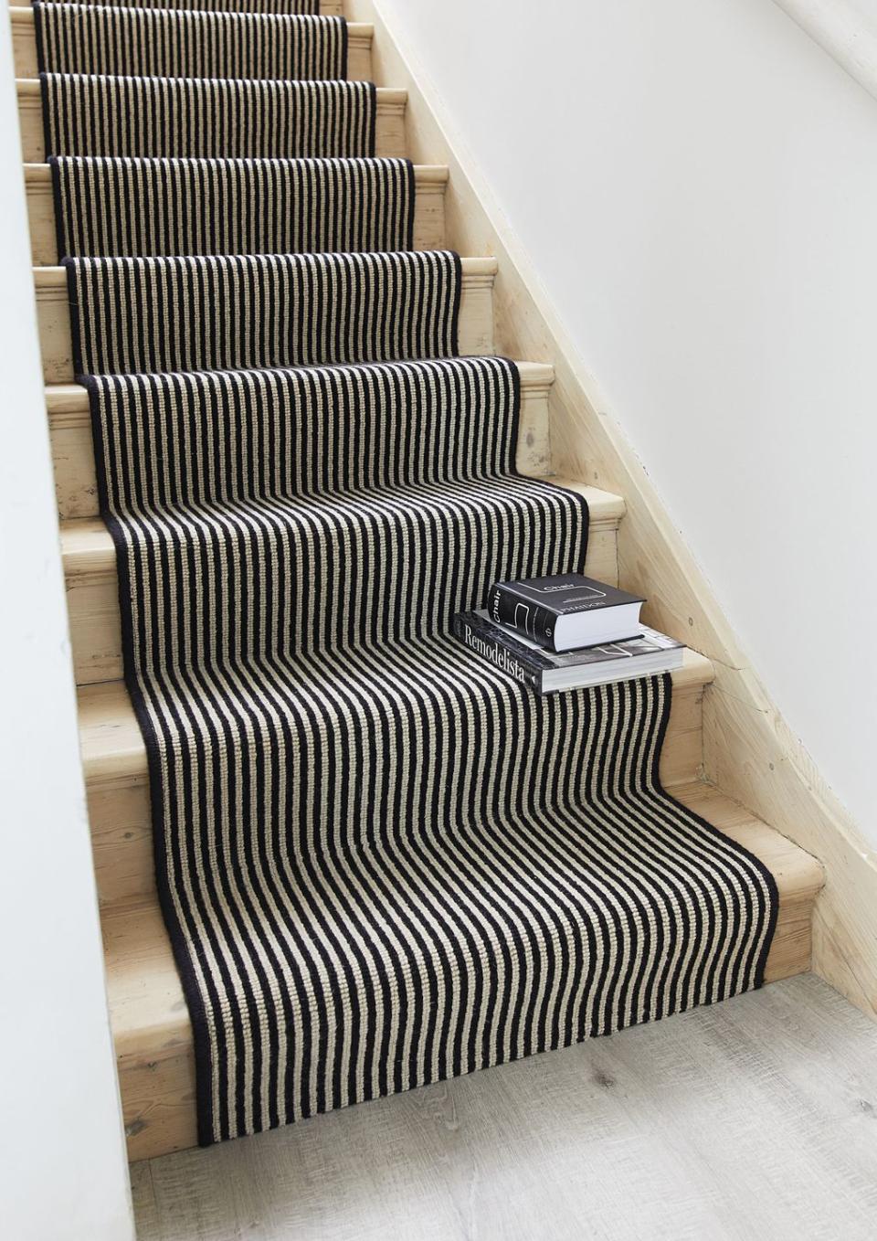 <p>Introduce pattern in a subtle way with a stair runner. This elegant striped wool carpet from Carpetright will draw the eye upwards, elongating your stairs and giving the impression of higher ceilings. Make sure to pick a hardwearing carpet for high traffic areas such as the stairs and hallway. </p><p>Pictured: <a href="https://www.carpetright.co.uk/carpets/portobello/" rel="nofollow noopener" target="_blank" data-ylk="slk:Portobello Wool Carpet at Carpetright;elm:context_link;itc:0;sec:content-canvas" class="link ">Portobello Wool Carpet at Carpetright </a></p>