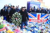 <p>The family of the Leicester owner pay tribute at Leicester City Football Club. Mike Egerton/PA Wire </p>