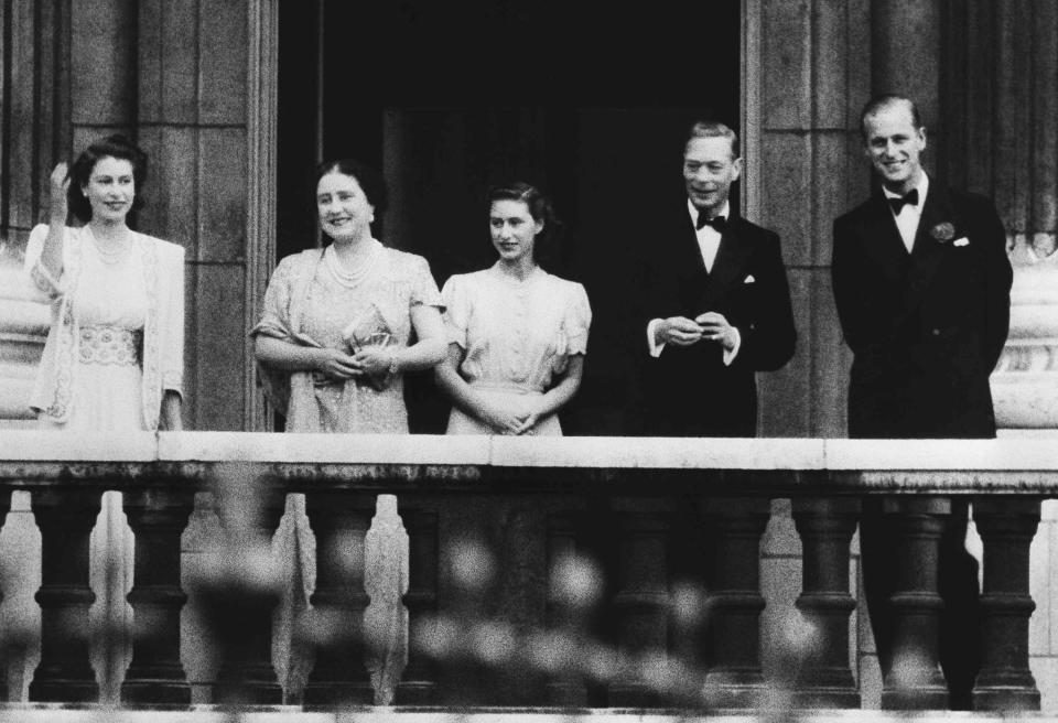 FILE - In this July 10, 1947 file photo, the newly betrothed royal couple, Princess Elizabeth, left, and Lieut. Philip Mountbatten, right, appear on the balcony of Buckingham Palace in London, with King George VI and Queen Elizabeth and Princess Margaret, center. Buckingham Palace officials say Prince Philip, the husband of Queen Elizabeth II, has died, it was announced on Friday, April 9, 2021. He was 99. Philip spent a month in hospital earlier this year before being released on March 16 to return to Windsor Castle. (AP Photo/File)