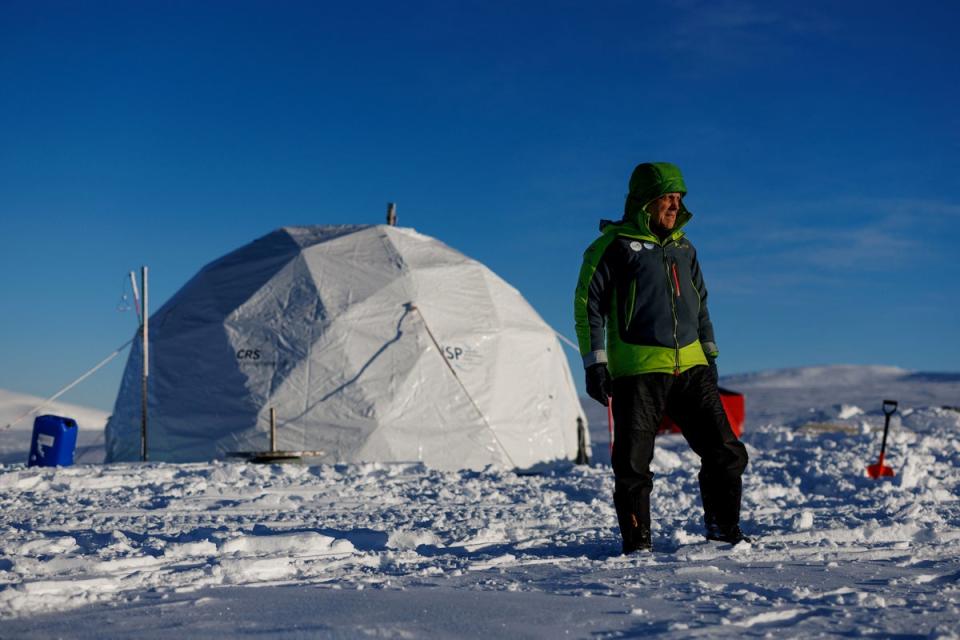 Ice Memory driller operator Victor Zagorodnov poses for a picture in front of the drilling tent (Reuters)