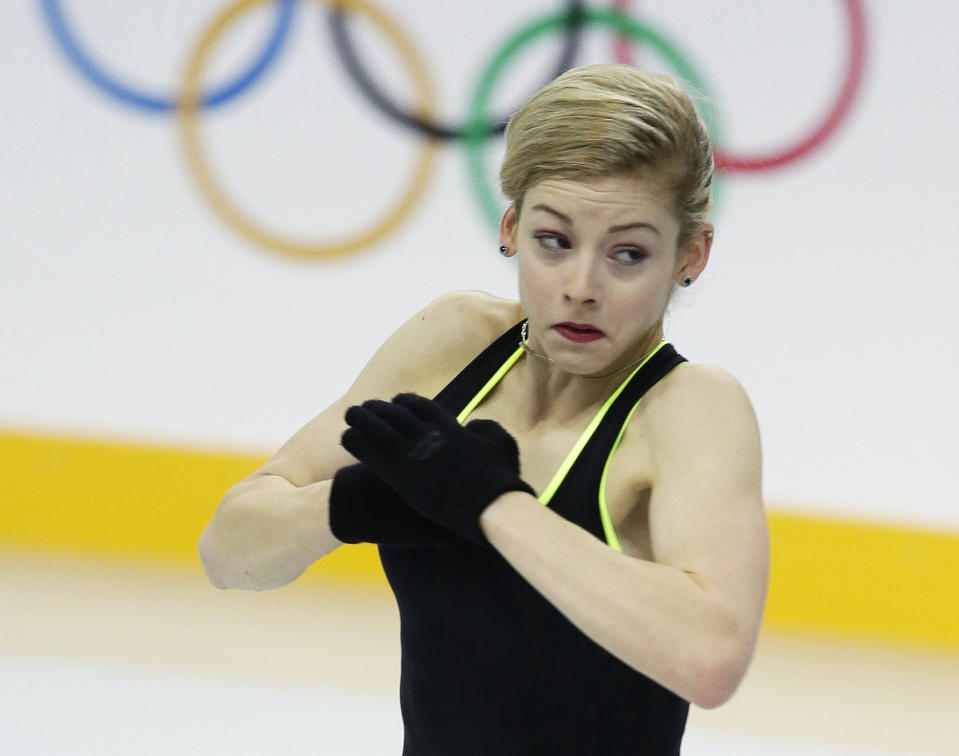 Gracie Gold of the United States skates during a practice session at the figure stating practice rink at the 2014 Winter Olympics, Tuesday, Feb. 18, 2014, in Sochi, Russia. (AP Photo/Darron Cummings)