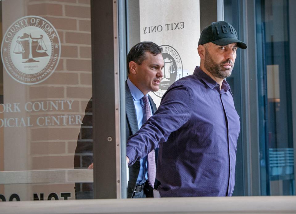 Bill Hynes, right, leaves the York County Judicial Center after a protection-from-abuse order hearing, followed by his attorney, Chris Ferro, in 2019.