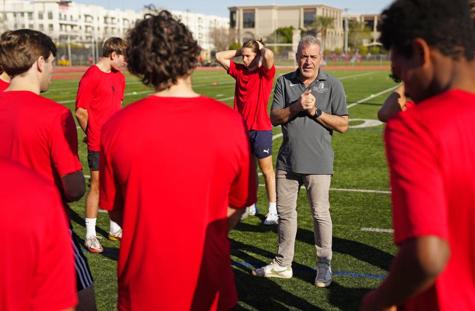 Brophy boys soccer head coach Marc Kelly talks with his team prior to a practice in Phoenix on Jan. 19, 2023.