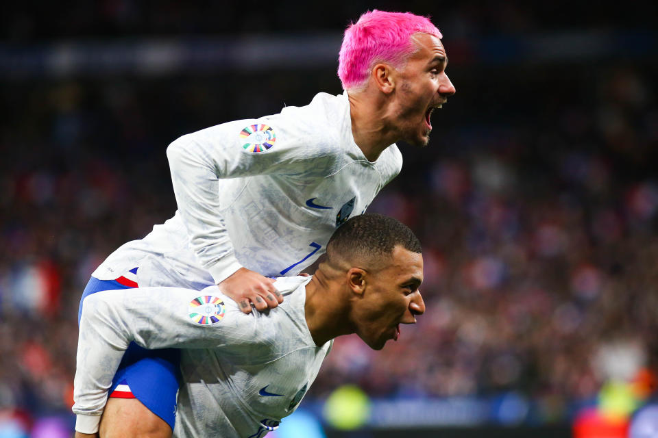 PARIS, FRANCE - MARCH 24: Antoine Griezmann (7) and Kylian Mbappe of France celebrate after scoring a goal during the UEFA EURO 2024 Qualifying Round Group B football match between France and Netherlands at Stade de France in Paris, France on March 24, 2023. (Photo by Ibrahim Ezzat/Anadolu Agency via Getty Images)