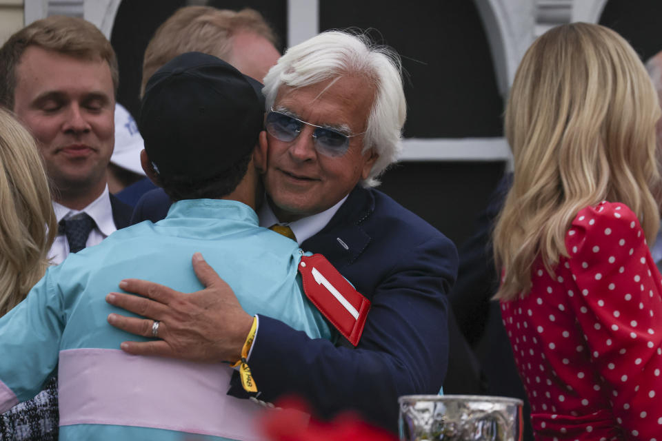 Bob Baffert, right, trainer of National Treasure, hugs jockey John Velazquez after their horse won the148th running of the Preakness Stakes horse race at Pimlico Race Course, Saturday, May 20, 2023, in Baltimore. (AP Photo/Julia Nikhinson)