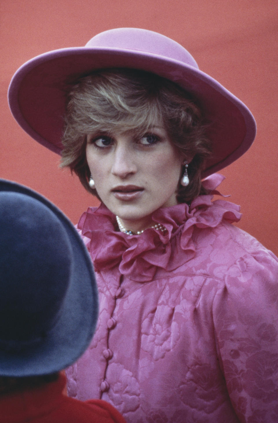 The Queen also lent the pearl necklace to Diana, Princess of Wales, seen here beneath a pink ruffled collar to greet Queen Beatrix of the Netherlands in 1982. (Getty Images)