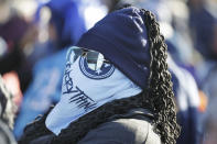 Tennessee Titans fan Jaime Wallace braves the cold weather at an outdoor viewing party in Nashville, Tenn., to watch the team play the Kansas City Chiefs in the AFC Championship NFL football game Sunday, Jan. 19, 2020. (AP Photo/Mark Humphrey)