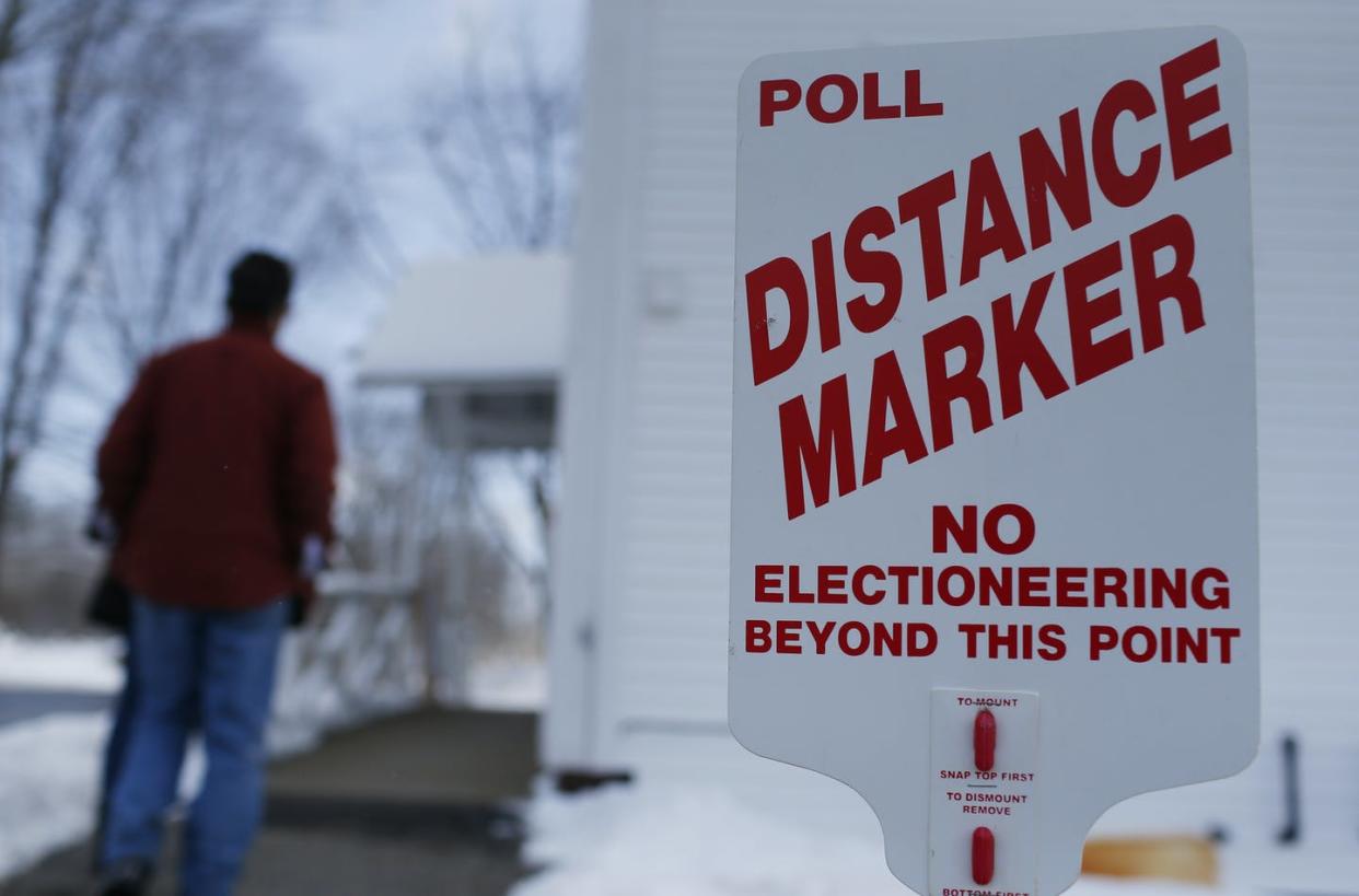 <span class="caption">A sign keeping campaigners at a distance in the New Hampshire presidential primary election at the Town Hall in Chichester, New Hampshire, Feb. 9, 2016. </span> <span class="attribution"><a class="link " href="https://www.gettyimages.com/detail/news-photo/voters-walks-into-a-polling-station-past-the-poll-distance-news-photo/541820484?adppopup=true" rel="nofollow noopener" target="_blank" data-ylk="slk:Jessica Rinaldi/The Boston Globe via Getty Images;elm:context_link;itc:0;sec:content-canvas">Jessica Rinaldi/The Boston Globe via Getty Images</a></span>