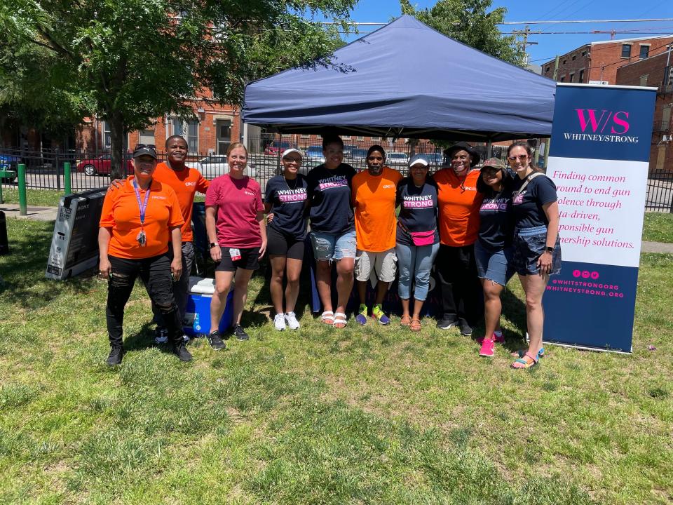 Whitney Austin, far right, poses with volunteers for Whitney/Strong, the non-profit gun safety advocacy group Austin founded after being shot 12 times in 2018.