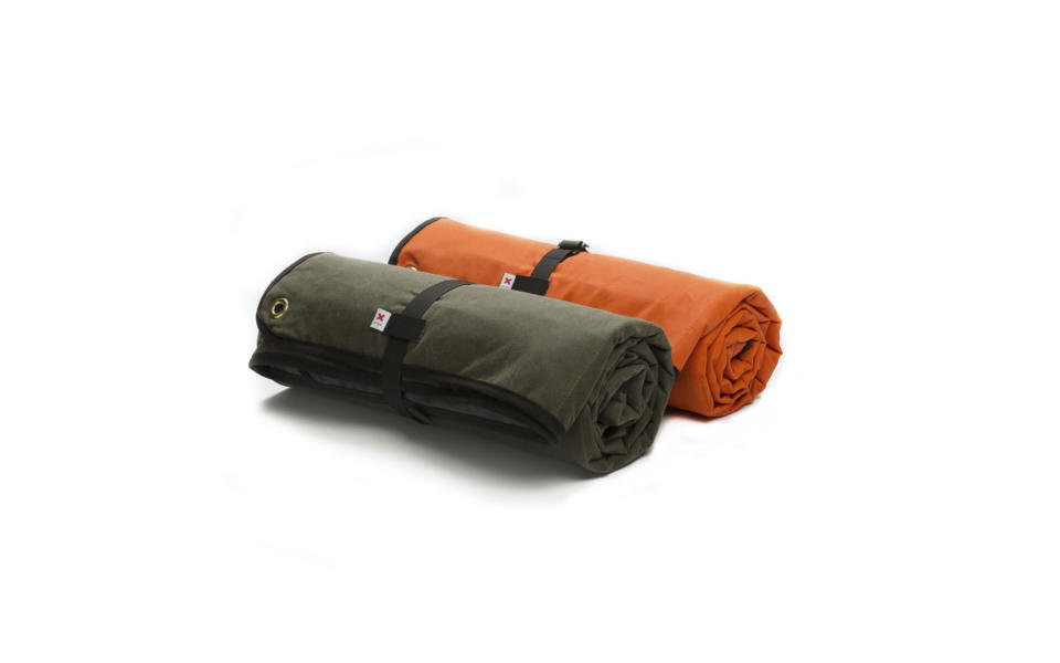 <p>Best Made Co.’s Canvas Blanket is warm, soft, and durable. The waxed sailcloth keeps the blanket dry, while the quilted cotton twill provides a comfortable surface to spread out on. Each corner has brass grommets, which means the blanket can be staked down or stung up as a makeshift shelter. </p> <p><strong>To buy:</strong> <a rel="nofollow noopener" href="https://www.bestmadeco.com/products/the-waxed-canvas-blanket" target="_blank" data-ylk="slk:bestmadeco.com;elm:context_link;itc:0;sec:content-canvas" class="link ">bestmadeco.com</a>; $178</p>