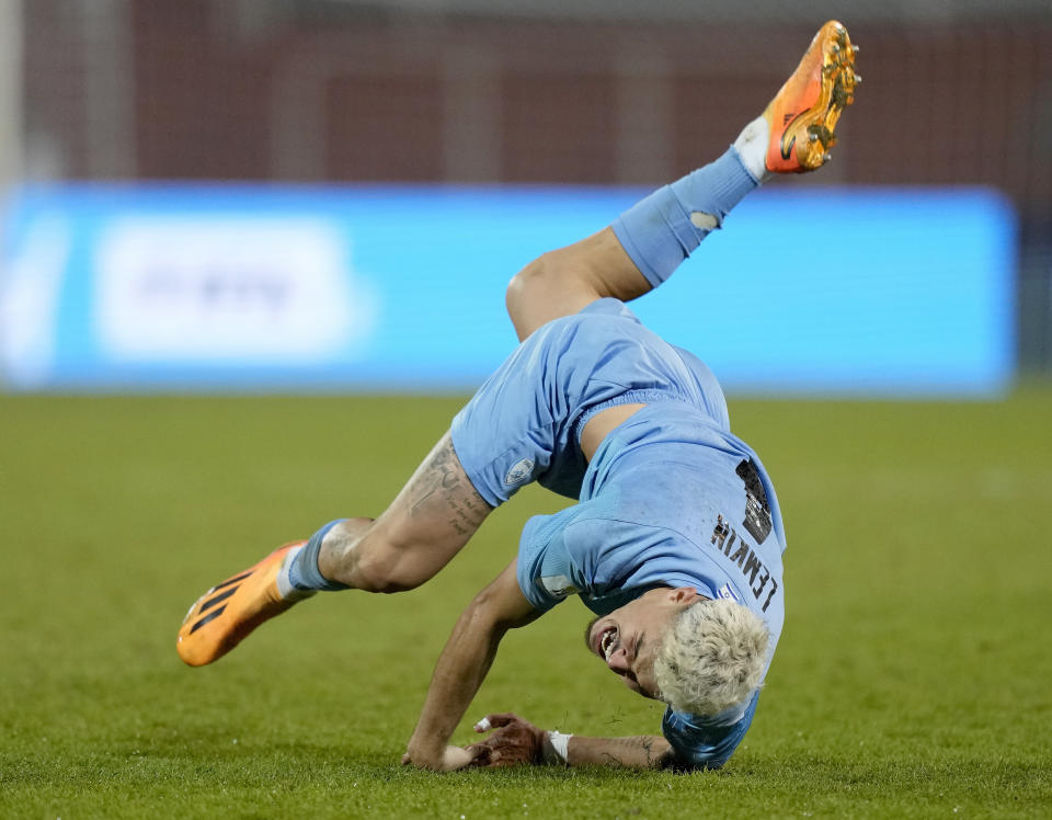 Israel's Stav Lemkin shouts in pain and falls on the pitch after clashing with Uzbekistan's Bekhruzbek Askaro during a FIFA U-20 World Cup round of 16 soccer match at the Malvinas Argentinas stadium in Mendoza, Argentina, Tuesday, May 30, 2023. (AP Photo/Natacha Pisarenko)