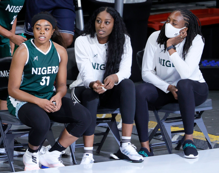 LAS VEGAS, NEVADA - JULY 18: (L-R) Erica Ogwumike #31, Chiney Ogwumike #15 and Nneka Ogwumike #30 of Nigeria look on from the bench during an exhibition game against the United States at Michelob ULTRA Arena ahead of the Tokyo Olympic Games on July 18, 2021 in Las Vegas, Nevada. The United Stated defeated Nigeria 93-62. (Photo by Ethan Miller/Getty Images)