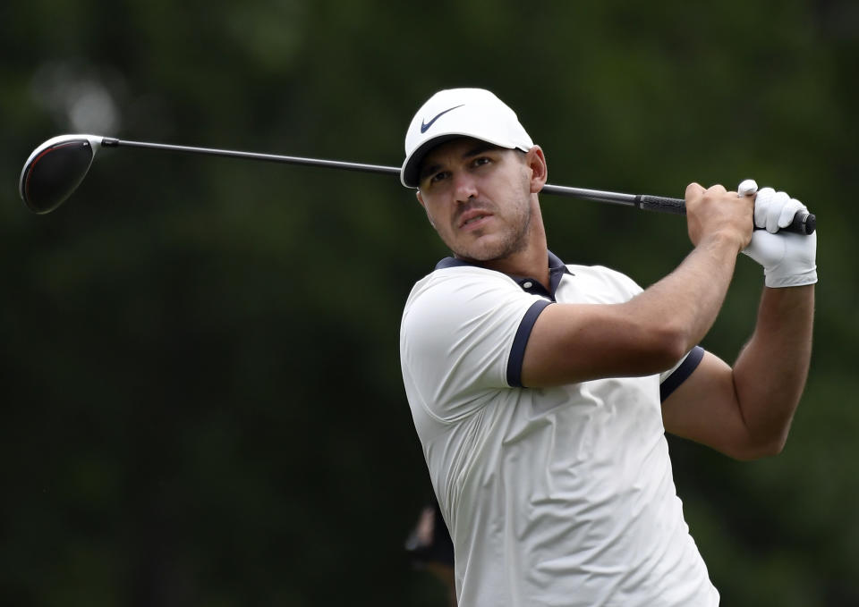 Brooks Koepka hits off the 18th tee during the third round of the Travelers Championship golf tournament, Saturday, June 22, 2019, in Cromwell, Conn. (AP Photo/Jessica Hill)