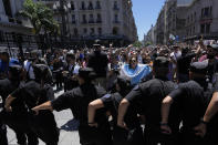 Police stand guard outside Congress where protesters marched to protest economic and labor reforms proposed by the government of Argentina's President Javier Milei, during a national strike in Buenos Aires, Argentina, Wednesday, Jan. 24, 2024. (AP Photo/Natacha Pisarenko)