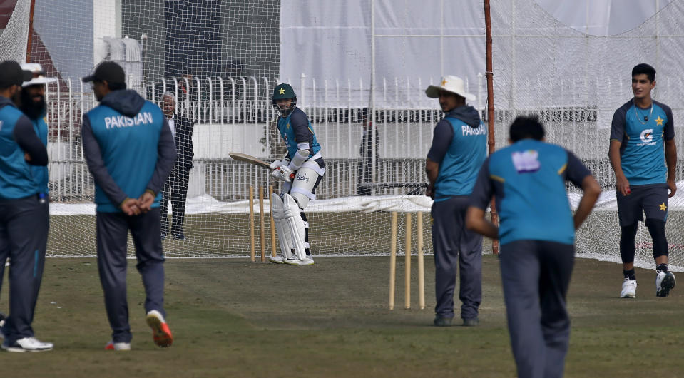 Pakistani skipper of test team Azhar Ali, center, attends a practice session with others for the first test match against Sri Lanka at the Pindi stadium in Rawalpindi, Pakistan, Monday, Dec. 9, 2019. (AP Photo/Anjum Naveed)