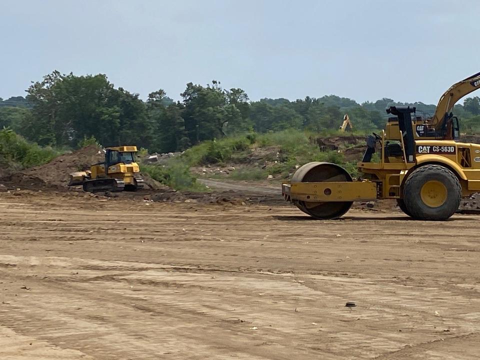 Work crews move or remove soil from a site that was damaged in the 1985 Labor Day fire. By next spring there should be a 295,000-square-foot warehouse on Eighth street in Passaic.