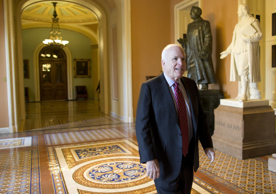 Sen. John McCain, R-Ariz., walks to a meeting with Senate Minority Leader Sen. Mitch McConnell, R-Ky., on Capitol Hill on Wednesday, Oct. 16, 2013 in Washington. (AP Photo/ Evan Vucci)