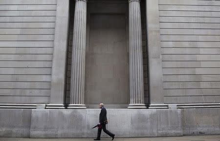 A man walks past the bank of England in London, Britain September 23, 2015. REUTERS/Neil Hall