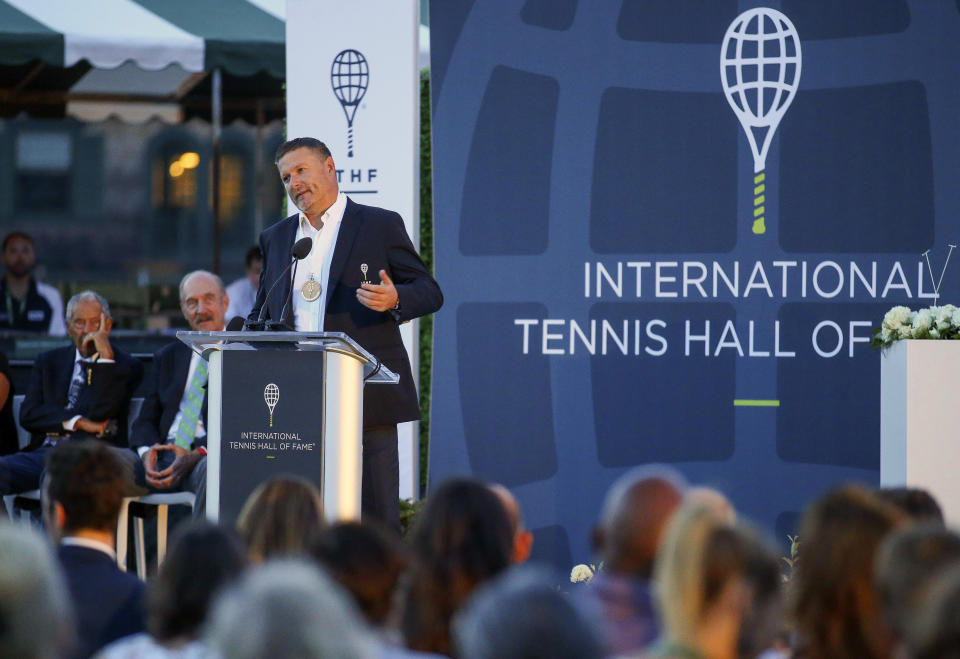 Tennis Hall of Fame inductee Yevgeny Kafelnikov, of Russia, speaks to the crowd during ceremonies at the International Tennis Hall of Fame, Saturday, July 20, 2019, in Newport, R.I. (AP Photo/Stew Milne)