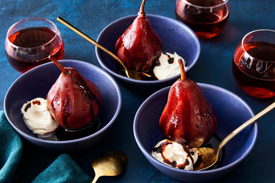 Pears poached in red wine with whipped cream