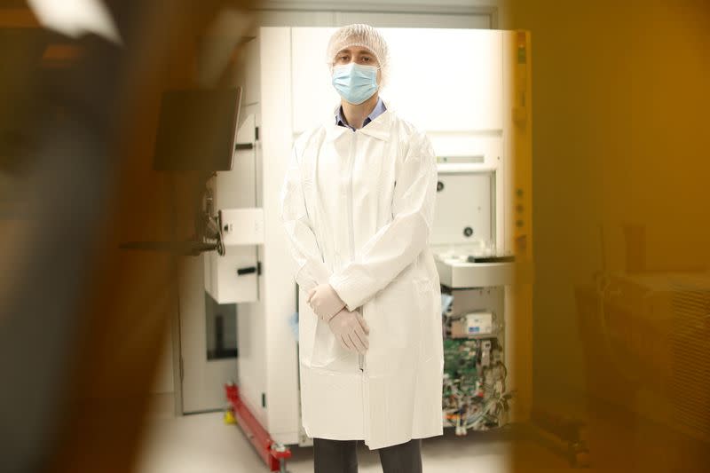 Alon Raphael, President and CEO of Femtometrix, is pictured through a laser curtain in the clean room of his laboratory in Los Angeles