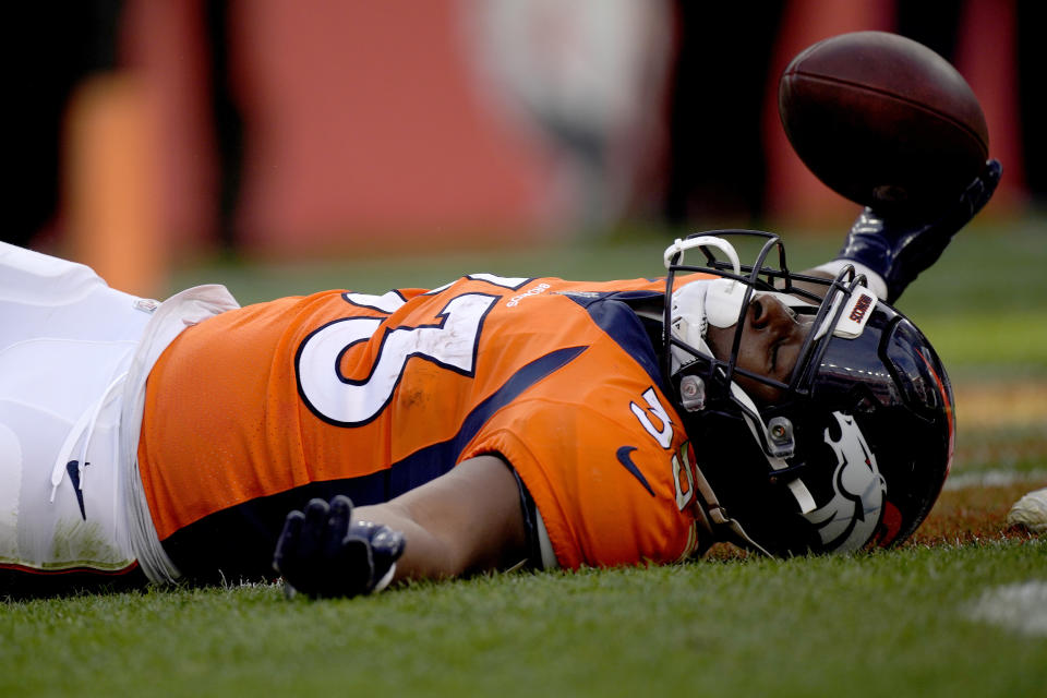 Denver Broncos running back Javonte Williams (33) celebrates his touchdown run against the Los Angeles Chargers during the first half of an NFL football game, Sunday, Nov. 28, 2021, in Denver. (AP Photo/David Zalubowski)