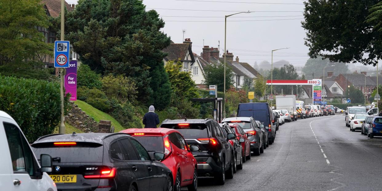 Motorists queue for fuel at an ESSO petrol station in Ashford, Kent.