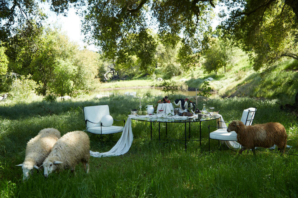 The Provence dining table and outdoor lounge chairs by House of Léon