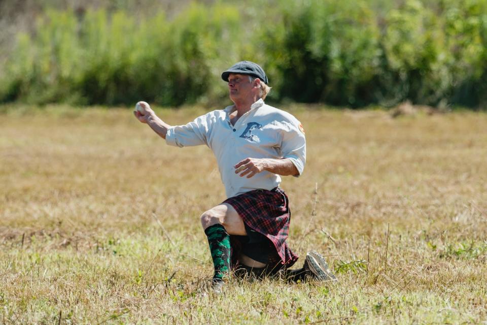 Right fielder Earl McDaniel of the Eastwood Iron Horses of Dayton makes a throw on a grounder during the ‘Diamonds & Drivers Vintage Baseball Tournament’ game against the Whiskey Island Shamrocks of Cleveland, Saturday, Aug. 27 at the field beside the Age of Steam Roundhouse Museum in Sugarcreek. Games are played using 1860’s rules, uniforms, equipment and etiquette.