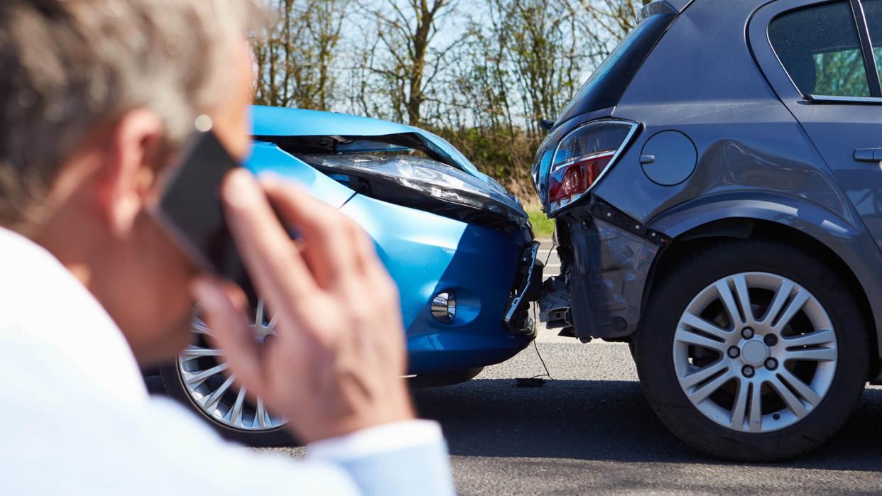 man dealing with a car wreck