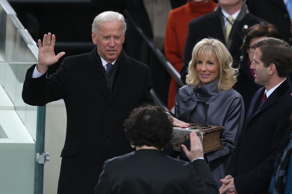 Jill Biden holds the bible on which her husband is sworn in as vice president for the second time, January 2013.