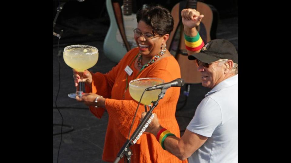 Jimmy Buffett and general manager Karen Sock toast the grand opening of the Margaritaville Casino and Restaurant in Biloxi on Tuesday May 22, 2012.